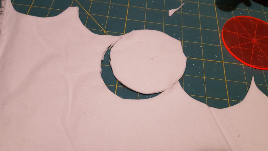 Cotton rounds tutorial image cutting mat fabric cut into a circle from round stencil