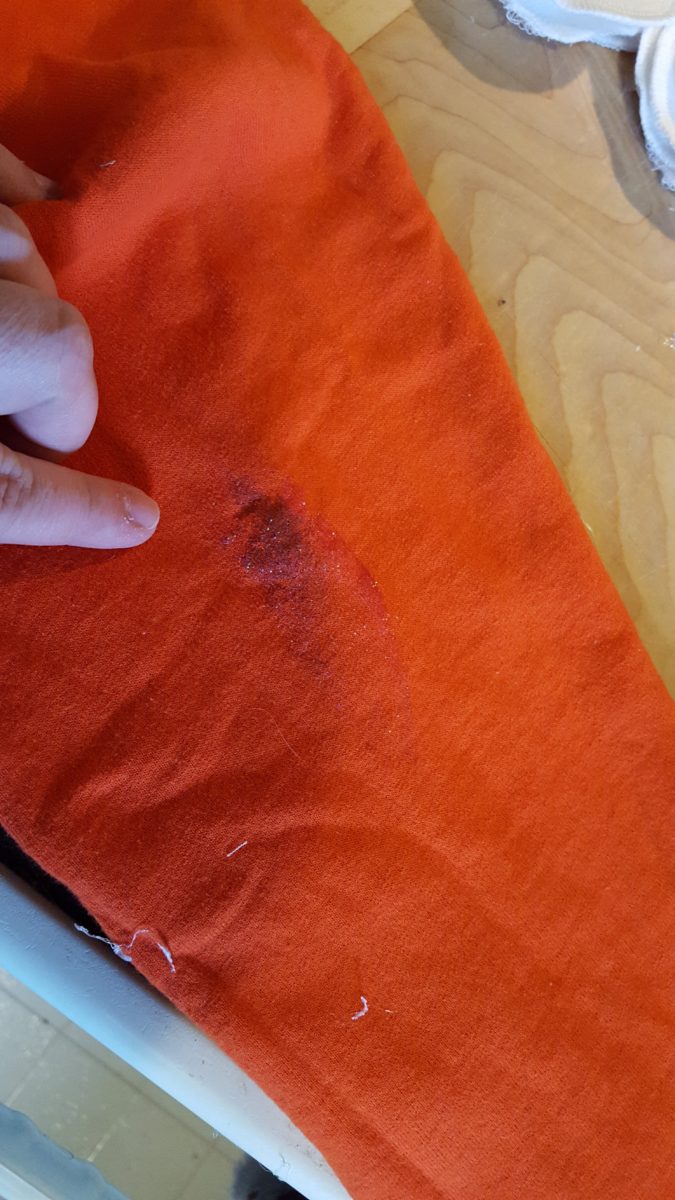 Snowman Pillow stained orange sweatshirt to use for the nose