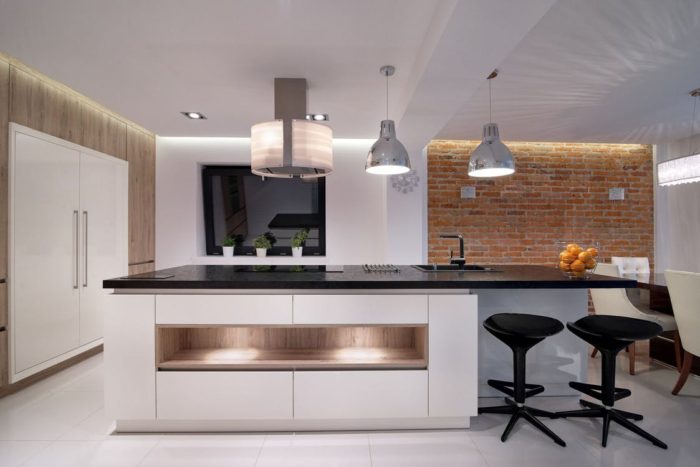 kitchen lights large refrigerator stools clean counters kitchen lighting brick wall white floors
