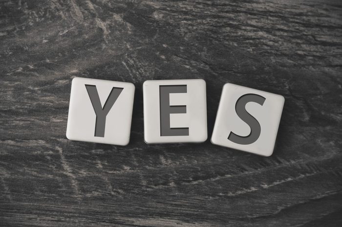 scrabble tiles that spell yes say yes more be positive