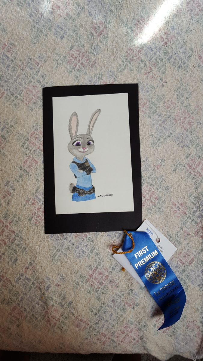 wall hanging of Zootopia bunny Judy Hopps inspired colored pencil drawing with first place blue ribbon at local Wisconsin fair