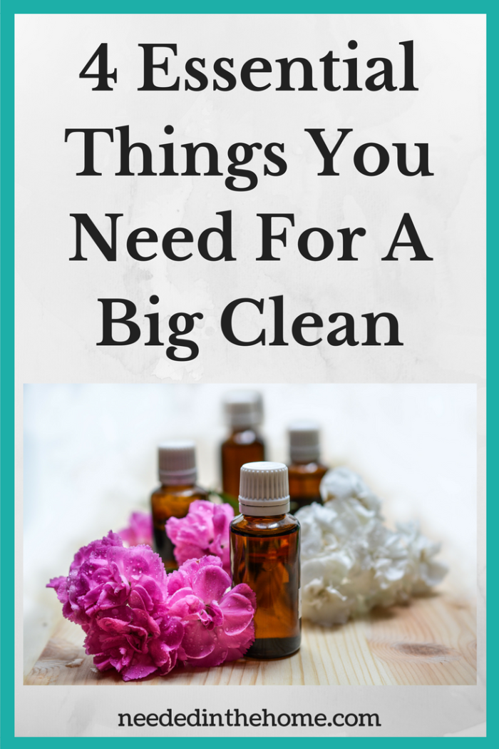 bottles of essential oils and flowers 4 Essential Things You Need For A Big Clean / Spring Cleaning / Deep Cleaning from NeededInTheHome