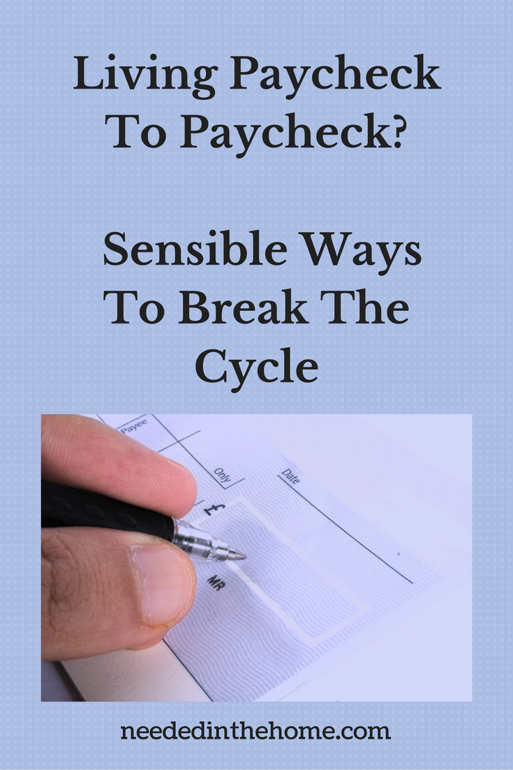 someone writing a check to pay a bill Living Paycheck To Paycheck? Sensible Ways To Break The Cycle