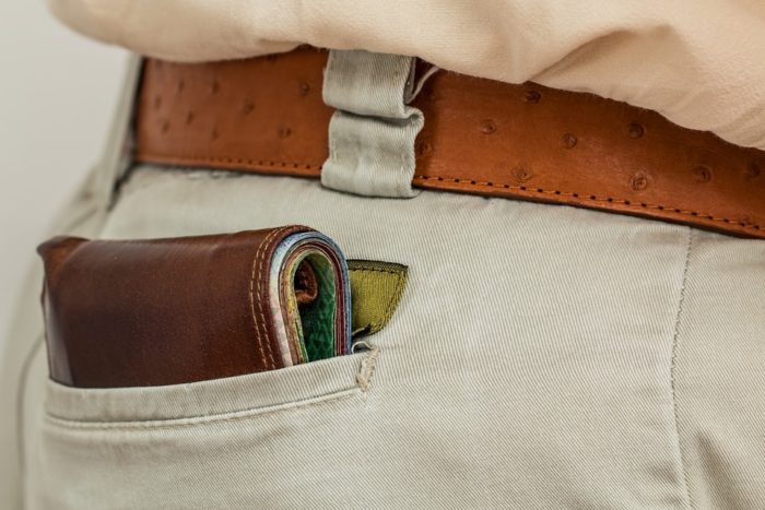 wallet in man's pocket The Personal Finance Guide That Could Change Your Life 
