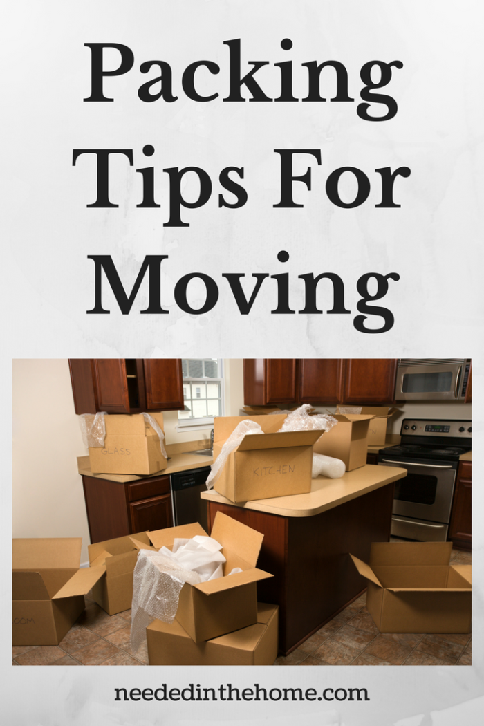cardboard boxes and packing materials in kitchen on counters and floor packing tips for moving neededinthehome.com