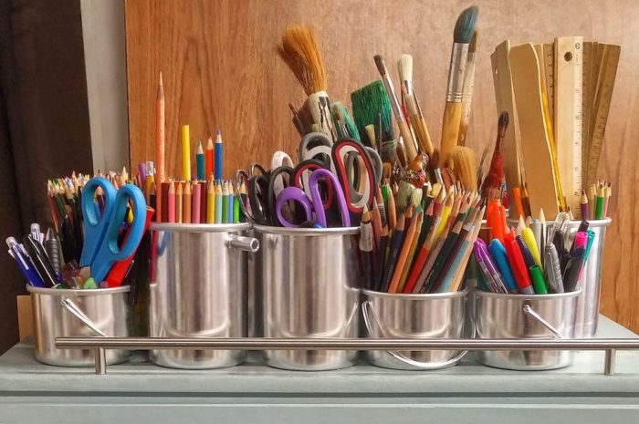 tins of art supplies scissors pens colored pencils paintbrushes markers rulers paint sticks what could really liven up your family home