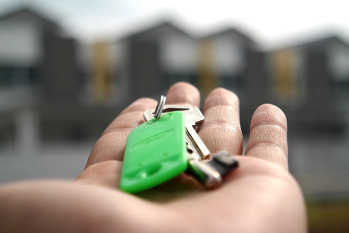 hand holding keys to new home Maintaining Control Throughout Your House Movee