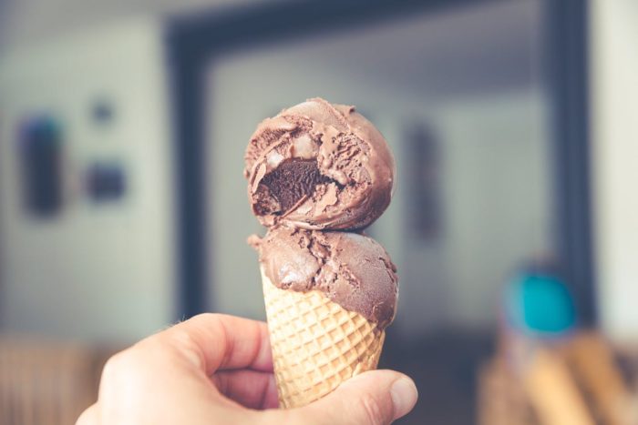 hand holding chocolate ice cream cone 3 big holiday vacation fails to avoid