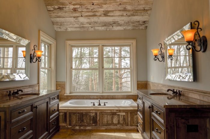 jacuzzi hot tub in bathroom two sinks counters mirrors wall lights antique barnboard barn board wood look luxury bathroom