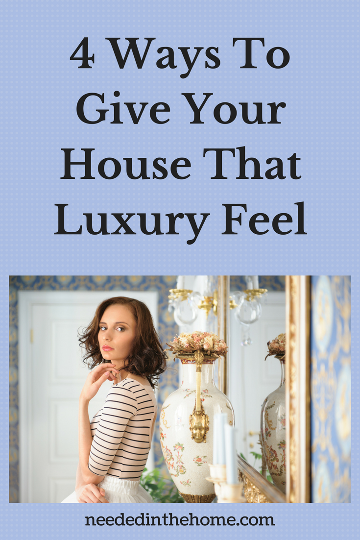 4 Ways To Give Your House That Luxury Feel Woman Looking At A Luxury Vase & Gold Trimmed Mirror neededinthehome