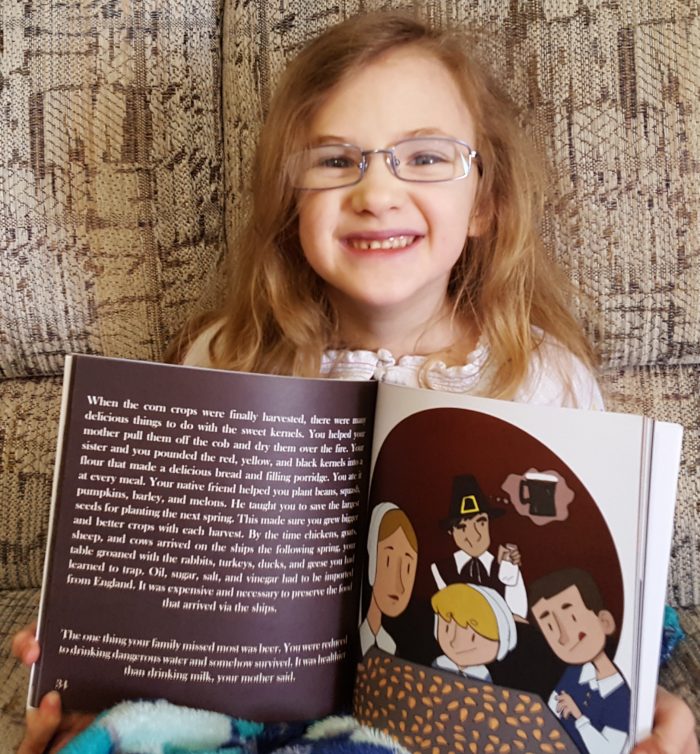 Product Review of If You Were Me And Lived In Colonial America paperback book by Carole P. Roman blond girl wearing glasses holding book