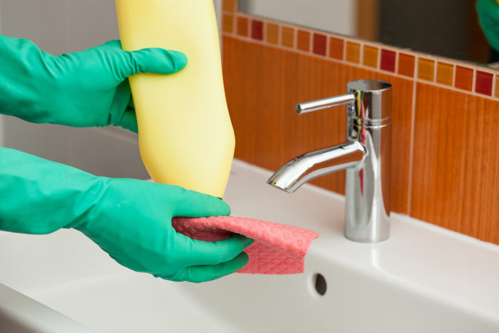 Eliminate embarrassing odors in the home gloved hands using dish soap and cloth to clean
