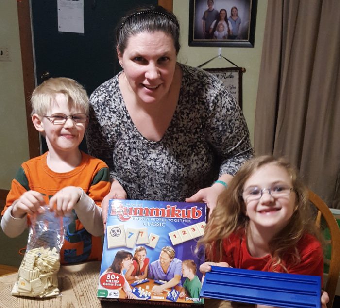 review of Goliath Games Rummikub mother and children getting ready to play and review Rummikub