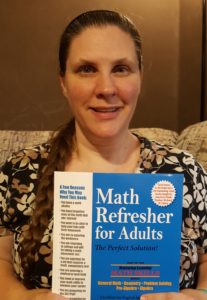 Math refresher for adults review image of Amy Marohl holding Math workbook