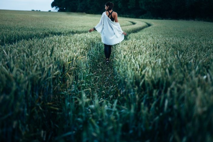 Personal development woman walking in a field