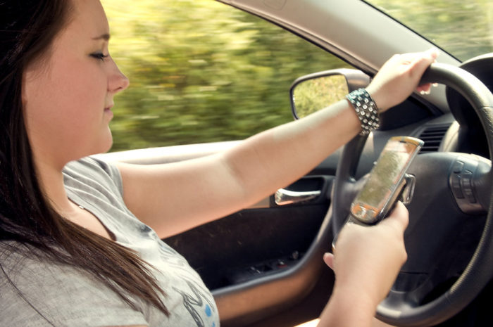 Kids Behind The Wheel teen girl texting while driving 