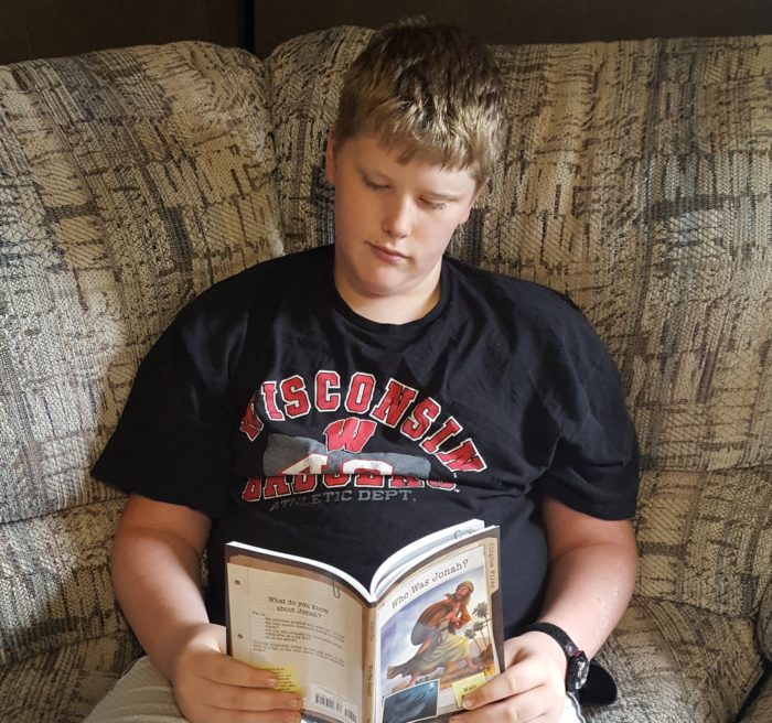 Kingdom Files teen boy reading chapter book Who Was Jonah? by Matt Koceich