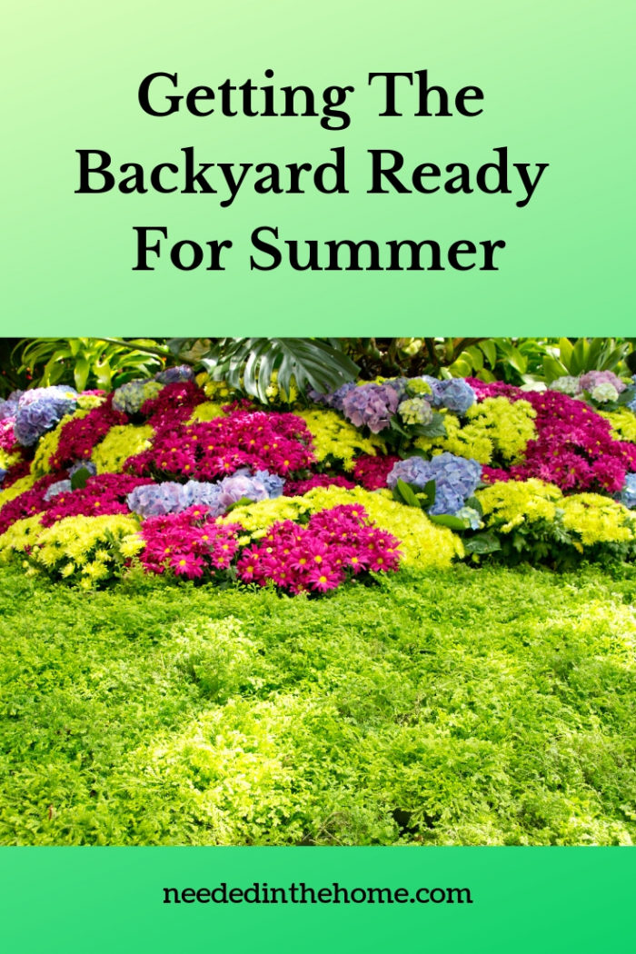 Getting the backyard ready for summer colorful flowers edging the backyard border neededinthehome