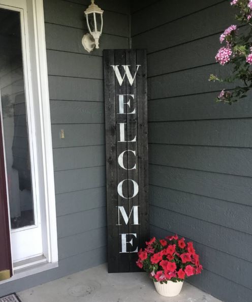 Mother's Day gifts for wife wooden welcome sign on front porch with flowers
