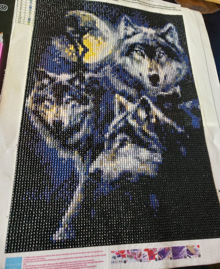 Diamond painting tutorial finished full drill canvas of wolves with moon in background 