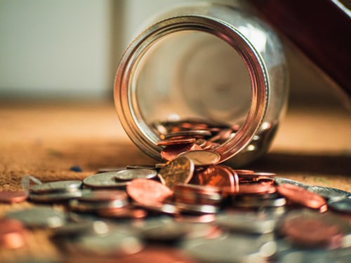 Quick fix money tips coins in glass jar tipped over