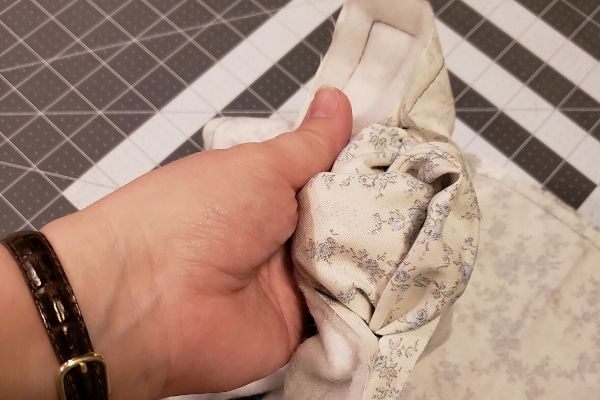 How to make a microwave potato bag turning fabric right side out with a three finger hole