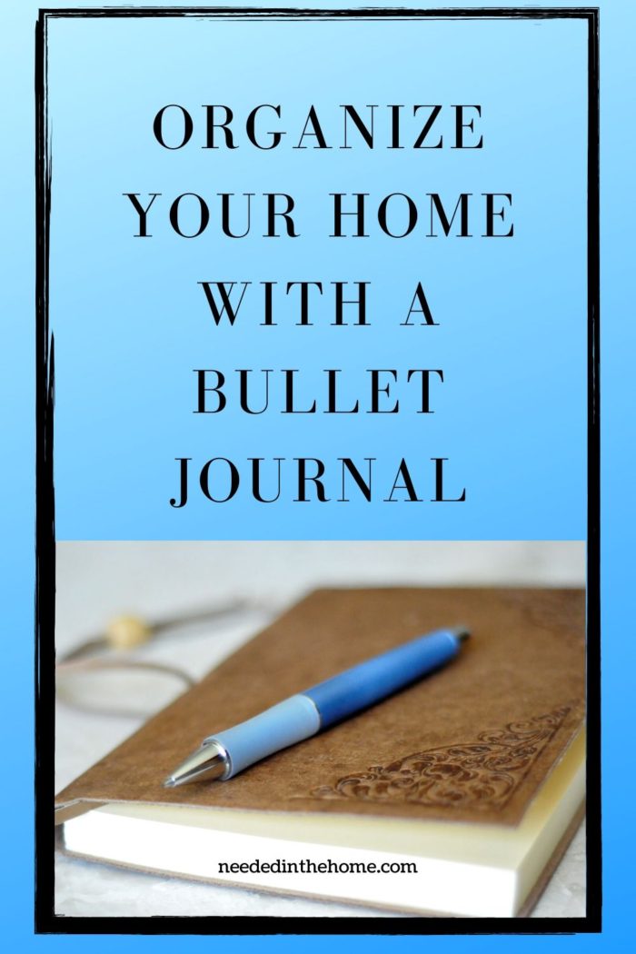 pinterest-pin-description Organize Your Home With A Bullet Journal pen laying on a brown leather journal with corner design neededinthehome