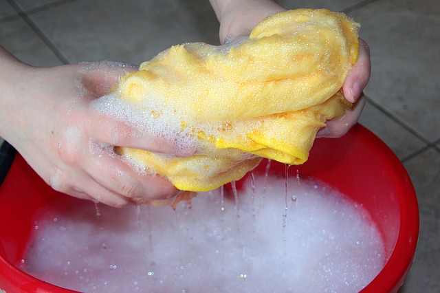 home clean and healthy with soap and water squeezing out rag soapy water bucket