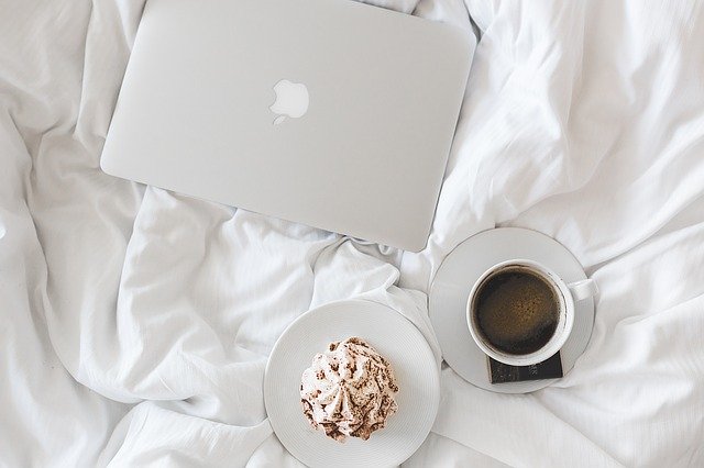 fulfilled in thehome laptop bed food coffee