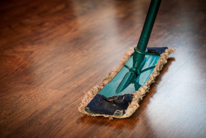 areas to declutter before you sell your home clear the floors wood floor dust mop