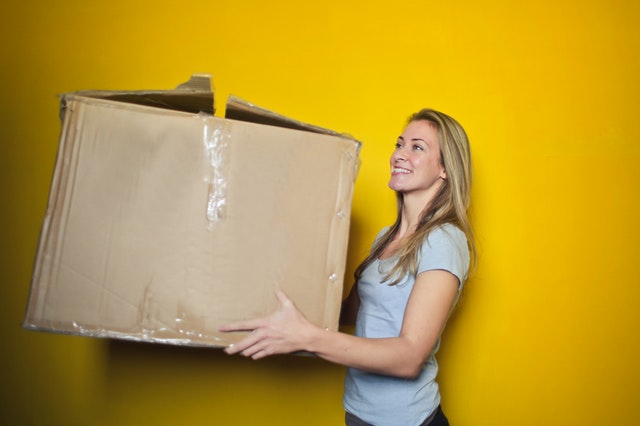 home move disasters woman carrying moving box
