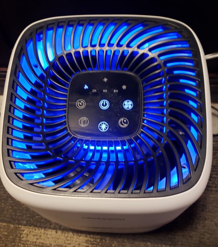 Product Review of Okaysou Air Purifier AirMic4S turned on low with it's blue light on.