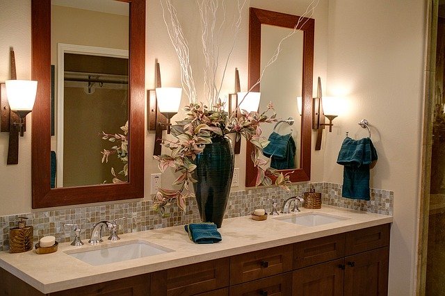 bathroom relaxing double vanity sink mirrors dark teal decor vase of orchids