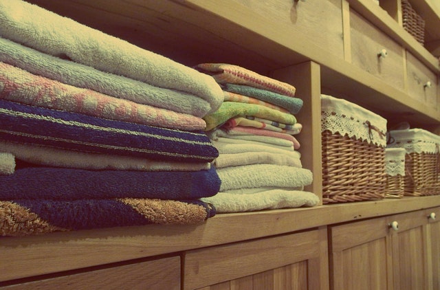 Laundry room yes please towels wicker canvas baskets wooden shelving