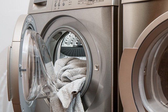 regular checks in your home laundry dryer door open towel