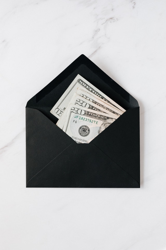 keep your costs down twenty dollar bills in an open black envelope
