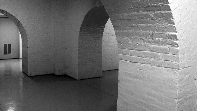 converting your basement empty basement with brick archways