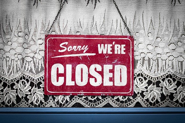 business interruption insurance sorry we're closed sign in business window