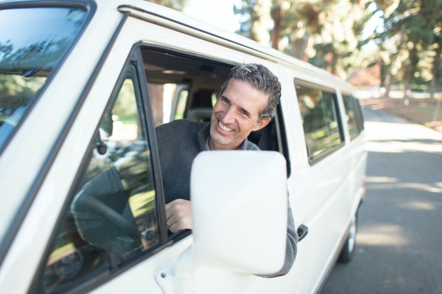 building your driving business mature man driving a van