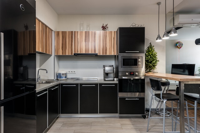 renovating your kitchen black cupboard doors granite countertops high table