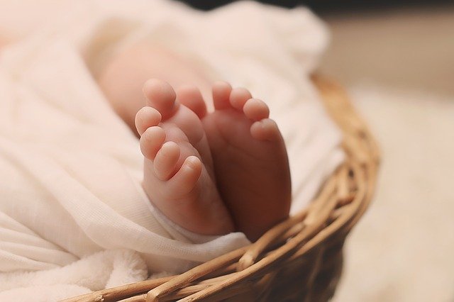 do more for your child's health baby feet in basket with blanket