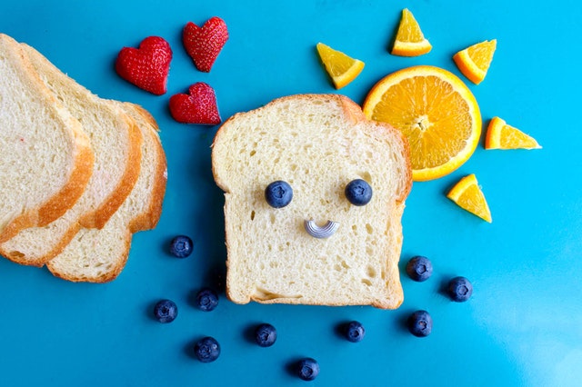 when your kid is a fussy eater food fun bread with smile made of blueberry eyes and macaroni smile sunshine from cut orange hearts from cut strawberries