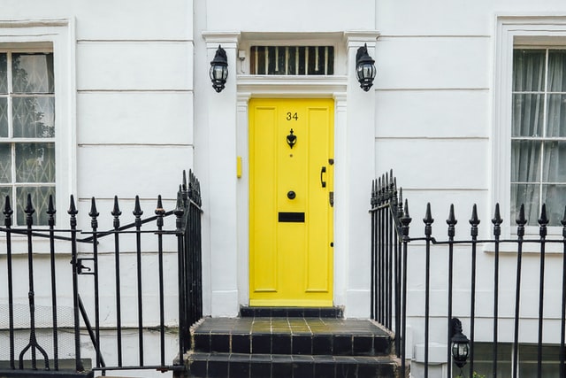 your home facelift front door painted bright color yellow on neutral white home