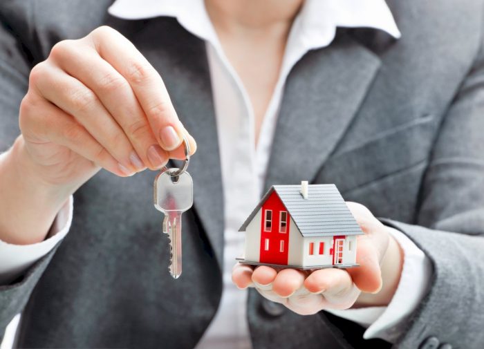 mom friendly careers woman holding key and mini house