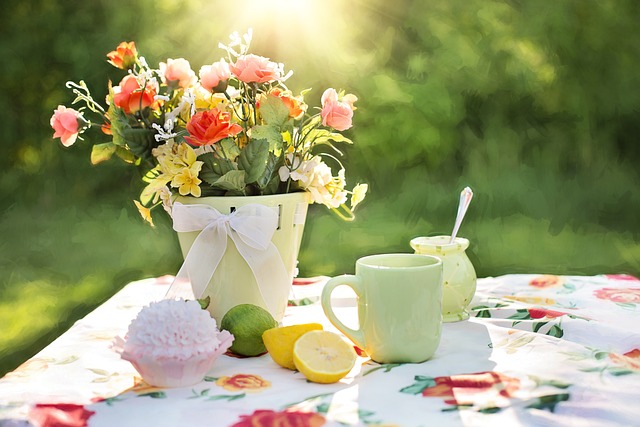 home ready for summer pot of fresh flowers lemons mug sugar on outdoor table