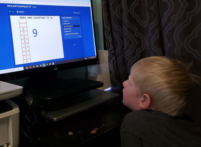 boy looking at online math curriculum number ladder nine