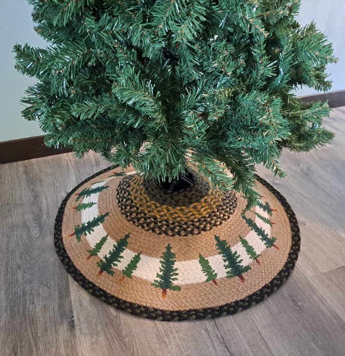 lower part of artificial tree with jute christmas tree skirt under it in living room