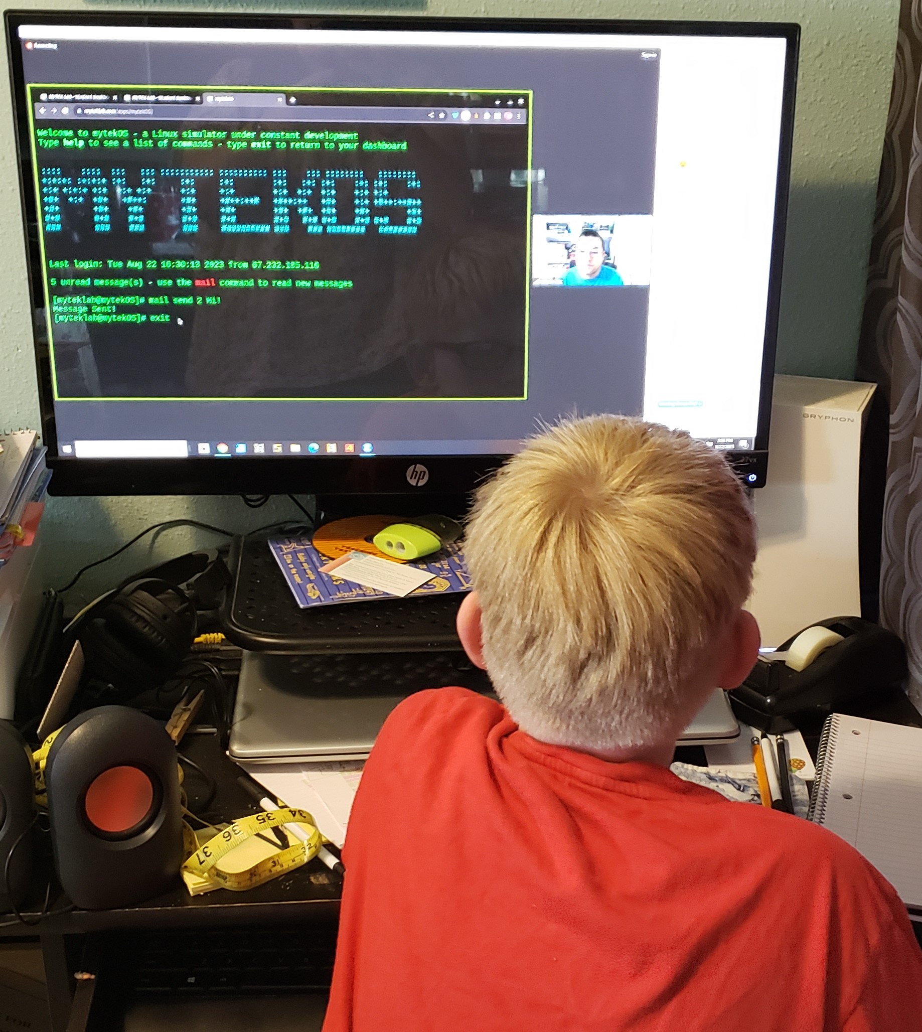 online technology classes boy watching teacher explain mytekos and coding language