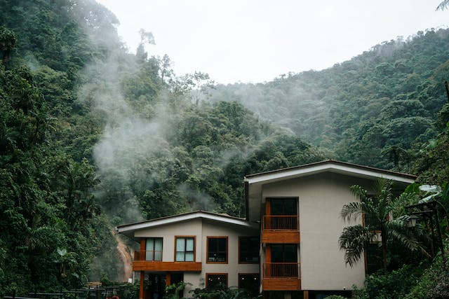 house in a tropical country setting built into a mountain