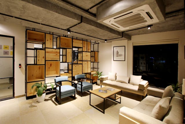 living room with sofas chairs built in shelving